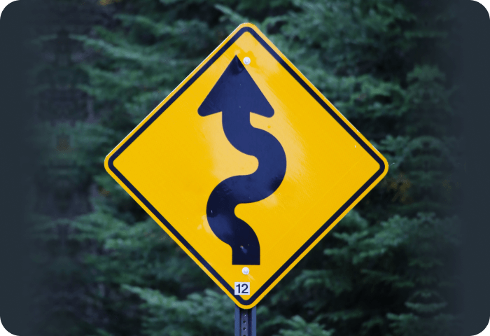 Curved road sign